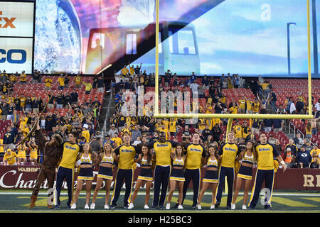 Landover, Maryland, USA. 24th Sep, 2016. The WVU cheerleaders sing Country Roads following a game played at FedEx Field in Landover, MD. WVU held on to beat BYU 35-32 to move to 3-0. © Ken Inness/ZUMA Wire/Alamy Live News Stock Photo