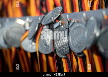 Berlin, Germany. 25th Sep, 2016. Medals waiting for the participants of the 43rd Berlin Marathon in Berlin, Germany, 25 September 2016. PHOTO: MAURIZIO GAMBARINI/dpa/Alamy Live News Stock Photo