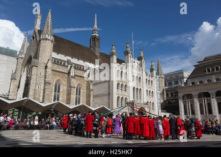 London, UK. 25 September 2016. Mayors from the London Boroughs and Pearly Kings and Queens dance around a may pole. The Costermongers Harvest Festival takes place at Guildhall Yard in the City of London. Credit:  Bettina Strenske/Alamy Live News Stock Photo