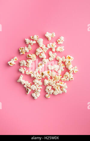 The popcorn on pink background. Stock Photo