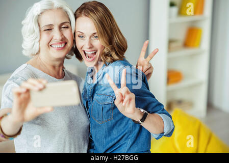 joyful woman and her daughter making selfies Stock Photo - Alamy