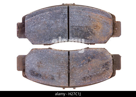 Set of old worn rusting brake pads or callipers for a car isolated on white in a concept of maintenance and replacement Stock Photo