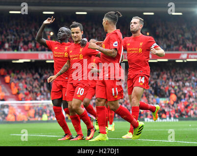 Liverpool's Philippe Coutinho (centre) celebrates scoring his side's fourth goal of the game during the Premier League match at Anfield, Liverpool. Stock Photo