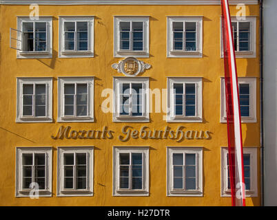 Yellow Facade of Mozart's Birthplace on Getreidegasse Street in Salzburg, Austria Stock Photo
