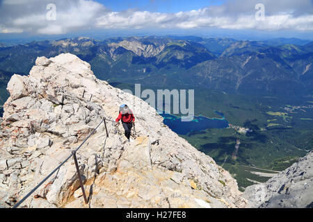 Hiker near the summit of Zugspitze Mountain, the highest in Germany. Stock Photo