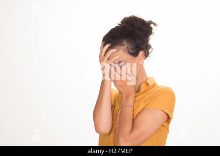 Upset young woman head in hands crying Stock Photo