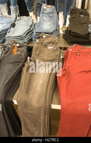 Store Display - Jeans Folded and Stacked on Table Stock Photo