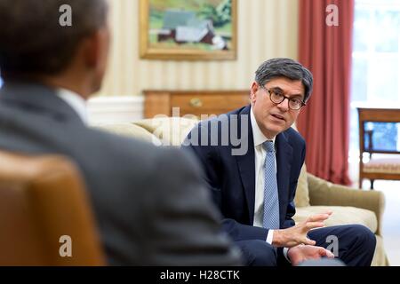U.S. President Barack Obama meets with Treasury Secretary Jack Lew in the White House Oval Office August 4, 2014 in Washington, DC. Stock Photo