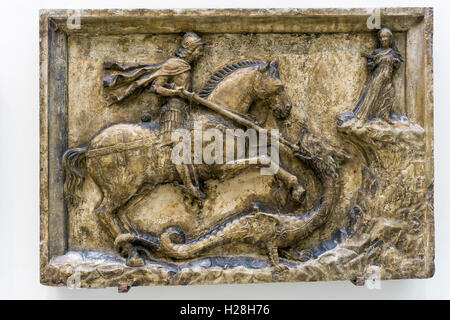 16th century stone relief of St George fighting dragon.  Originally from a house in Venice, now in the Victoria & Albert Museum. Stock Photo