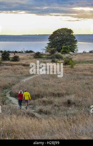 A couple hiking in sunset Stock Photo