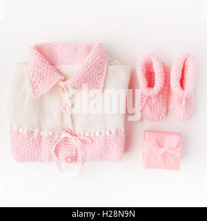 Socks and cloth-pants for baby newborn on white background. Children apparel concept. Flat lay, Top view Stock Photo