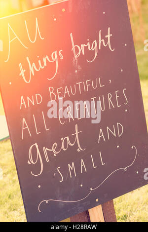 'All things bright and beautiful all creature great and small' chalked on a sign at Dalyseford autumn show. England Stock Photo