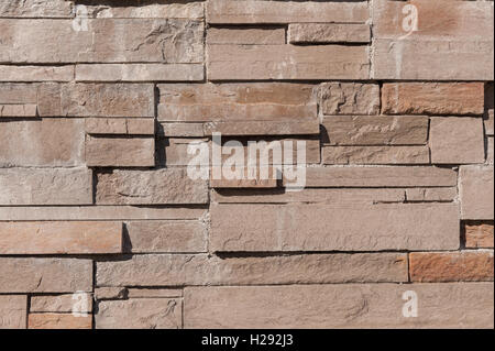 closely stacked dry stone wall slate quartz layers of stone showing texture Stock Photo