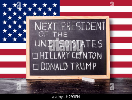 American election concept with flag and handwriting text next president of United States Donald Trump Hillary Clinton written in Stock Photo