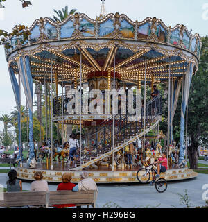 Carousel in motion in the Gardens of Pereda city of Santander, Cantabria, Spain Stock Photo