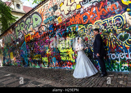 Wedding Prague Just Married at Famous John Lennon Wall, Velkoprevorske Square, Prague, Czech Republic Stock Photo