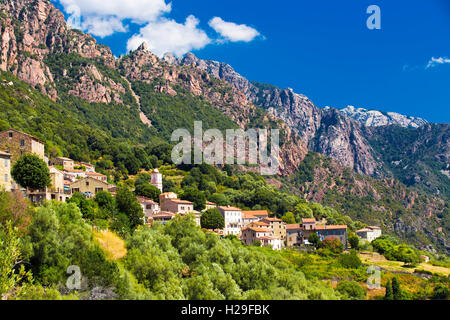 Ota town with the mountains in the background near Evisa and Porto, Corsica, France. Stock Photo