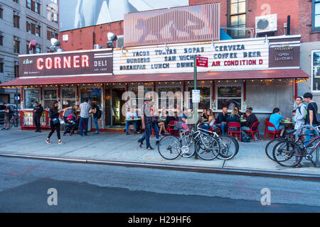 Alfresco dining outside the Corner Deli, La Esquina, a Mexican restaurant in Nolita in New York City Stock Photo