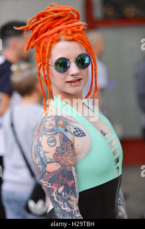 London, UK. 25th Sep, 2016. A tattooed woman at the 12th London International Tattoo Convention, which took place in Tobacco Dock, east London over the weekend. The show featured over 400 of the world's finest, most prestigious and elite tattoo artists as well as a showcasing alternative culture in the form of piercing, burlesque and the Miss Pin Up UK competition. Around 20,000 people attended over the weekend. Credit:  Michael Preston/Alamy Live News