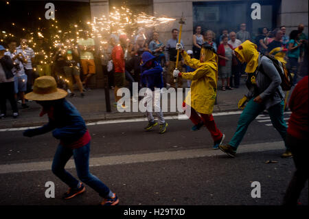 Barcelona, Spain. 25th Sep, 2016. September 25, 2016 - Barcelona, Catalonia, Spain - Young revelers take part in a correfoc during La Merce Festival in Barcelona. Correfocs, an old Catalan tradition where people dressed as devils blow up firecrackers and flares, take part every September in the celebrations for La Merce Festival in the city of Barcelona. Credit:  Jordi Boixareu/Alamy Live News Stock Photo