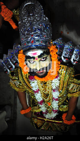 Allahabad, Uttar Pradesh, India. 26th Sep, 2016. An Artist dressed as Demon king Rawan ahead of a religious procession Ravan ki Barat in Allahabad, held to mark the Dussehra festival. The name Dussehra is derived from Sanskrit Dasha-hara literally means removal of ten referring to Lord Rama's victory over the ten-headed demon king Ravana. Dussehra is celebrated on the tenth day of the month of Ashwin according to the Hindu calendar which corresponds to September or October of the Gregorian calendar. © Prabhat Kumar Verma/ZUMA Wire/Alamy Live News Stock Photo