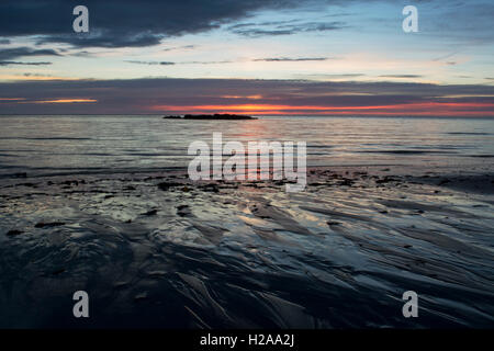 Sunsetting on a low tide Stock Photo