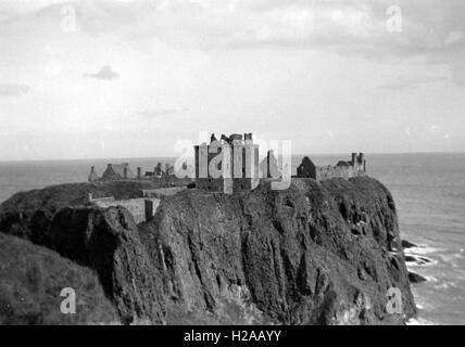 The spectacular Duntulm Castle ruins stand on the north coast of Trotternish, on the Isle of Skye in Scotland, near the hamlet of Duntulm. During the 17th C it was the seat of the chiefs of Clan MacDonald of Sleat. Image date c1930. Today much of the ruins have gone with the towers falling into the sea. Photo by Tony Henshaw Stock Photo