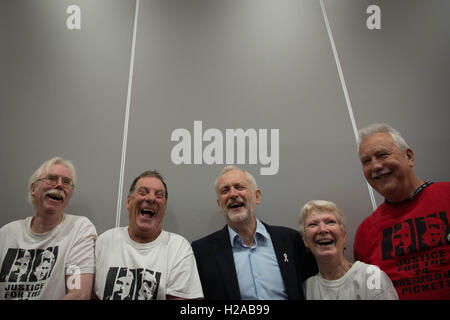 Labour leader Jeremy Corbyn (centre)tours the exhibition stands and meets supporters during the second day of the Labour Party conference in Liverpool. Stock Photo