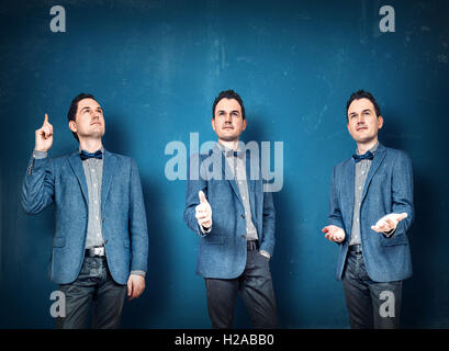Businessmen in blue suit in various postures Stock Photo