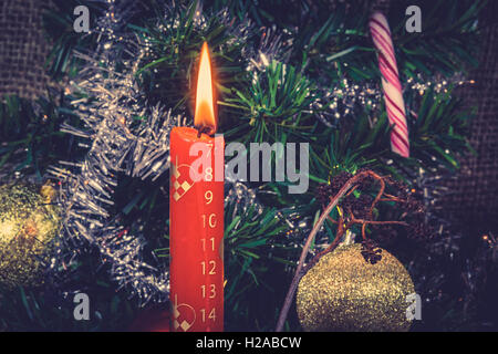 Red Christmas candle counting down for Xmas Stock Photo