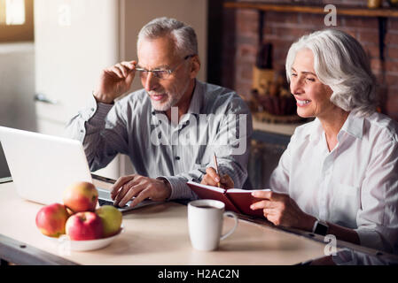 Mature couple doing internet research Stock Photo