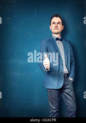 Gentleman in a blue jacket giving thumbs up Stock Photo