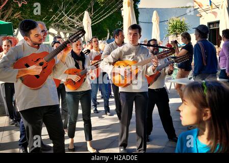 Traditional Canary Islands musicians string band play guitars and lutes in the Plaza Leon y Castillo in town of Haria, Lanzarote Stock Photo