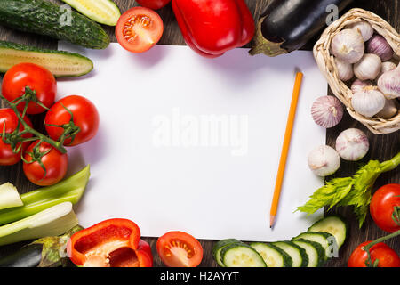 Vegetables tiled around a sheet of paper Stock Photo