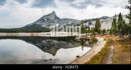 Trail at the lake, mountains reflected in a lake, Cathedral Peak, Lower Cathedral Lake, Sierra Nevada, Yosemite National Park Stock Photo