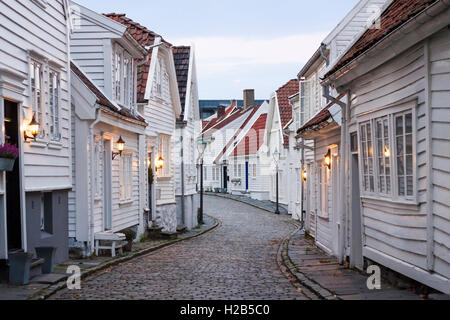 Traditional scandinavian cobblestone street with white houses in Stavanger, Norway Stock Photo