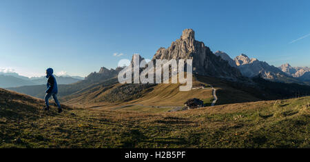 Hiker in the Italian Dolomites at Passo Giau in Belluno / Veneto - Italy Stock Photo