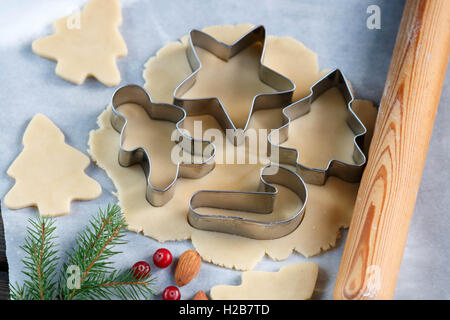 Christmas baking background. Christmas cookie cutters molds on the kitchen  baking table. Festive food and New Year's mood. High quality photo Stock  Photo - Alamy