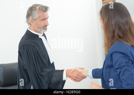lawyer meeting client in courthouse office Stock Photo