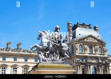 Statue of king Louis XIV in the courtyard of the Louvre museum. Made by Gian Lorenzo Bernini Stock Photo