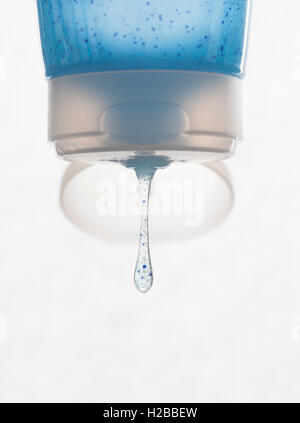 Tube of face scrub containing microbeads. Blue tube on a white background. Stock Photo