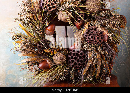 Festive autumn wreath with acorns and fall leaves Stock Photo