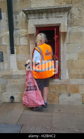 Royal mail postman collecting letters street red postbox van talking to Royal mail postman collecting letters street red postbox van talking to