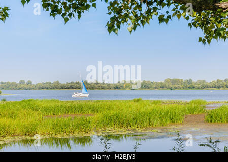 Kiev/Ukraine - August 22, 2016 - A sail boat on the Dnieper river in Kiev, Ukraine, under a nice and clean blue sky, during the Stock Photo