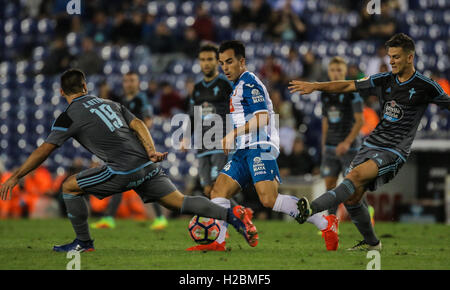 Jose Manuel Jurado passing the ball between two Celta's players. Spanish League match between RCD Espanyol vs Celta de Vigo at C Stock Photo