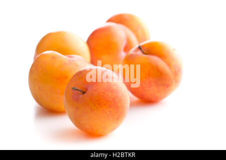 Ripe yellow plums isolated on white background. Stock Photo