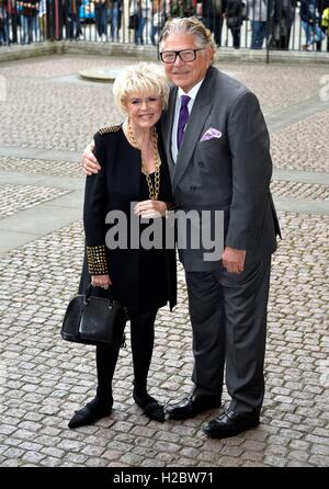 Gloria Hunniford and husband Stephen Way arrive for the Service of Thanksgiving for Sir Terry Wogan at Westminster Abbey, London. Stock Photo