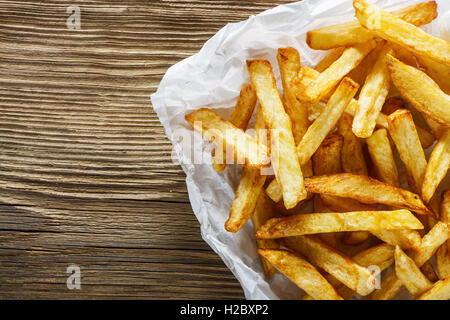 French fries on wooden table Stock Photo