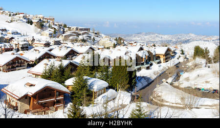 Faraya or Mzaar Kfardebian ski resort in Lebanon during winter, covered with snow. Winter in Middle East Stock Photo