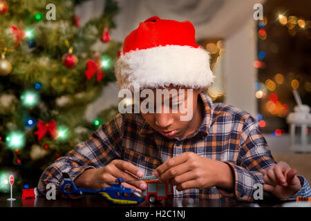 Afro kid playing on Christmas. Stock Photo